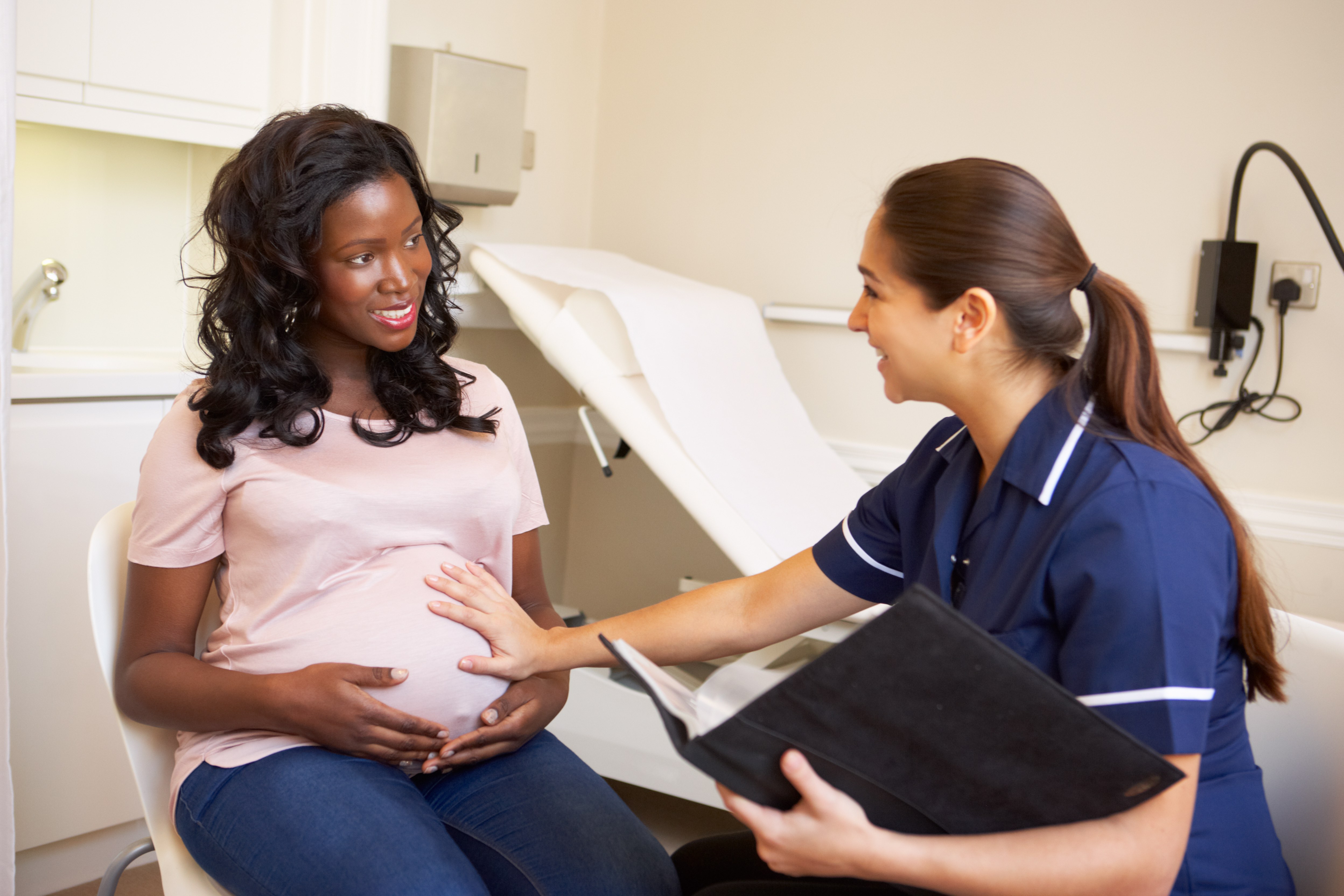Black pregnant patient and provider